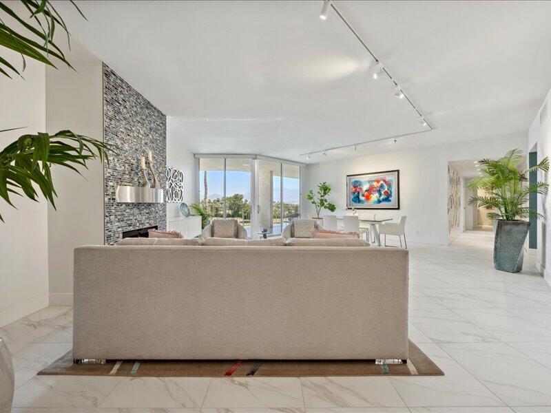 900 Island Drive, Unit 503 Rancho Mirage, CA 92270 - Photo 15 of 31 a living room with furniture and a potted plant