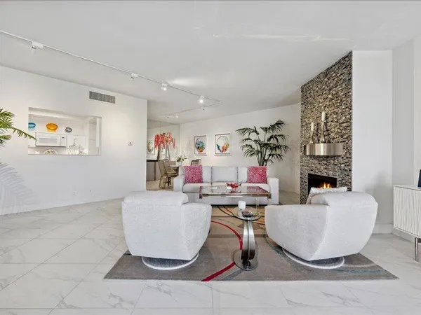 a living room with furniture and a table