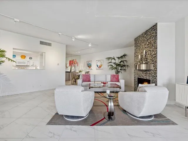 a living room with furniture and a table