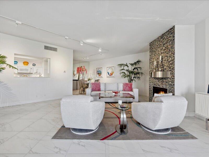 900 Island Drive, Unit 503 Rancho Mirage, CA 92270 - Photo 16 of 31 a living room with furniture and a table
