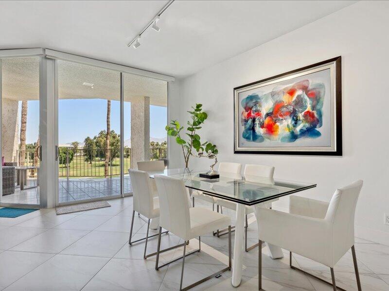 900 Island Drive, Unit 503 Rancho Mirage, CA 92270 - Photo 18 of 31 a dining room with furniture and wooden floor