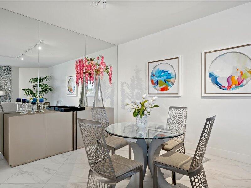 900 Island Drive, Unit 503 Rancho Mirage, CA 92270 - Photo 23 of 31 a view of a dining room with furniture a kitchen and chandelier