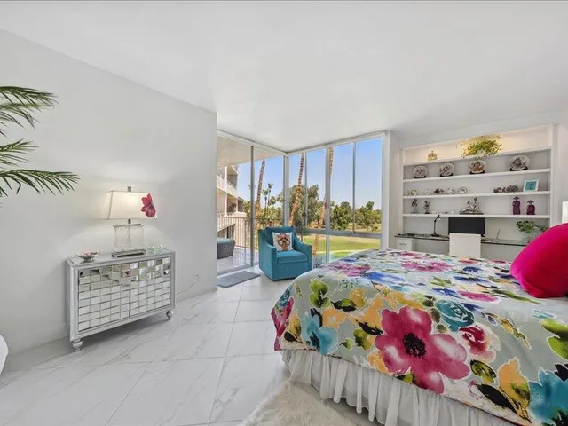 a bedroom with bed and window