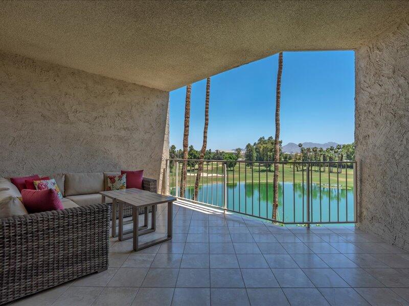 900 Island Drive, Unit 503 Rancho Mirage, CA 92270 - Photo 7 of 31 a view of a balcony with lake view and a potted plant