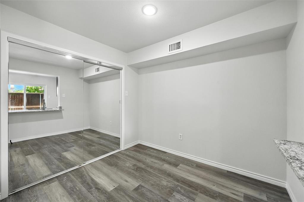 5626 Preston Oaks Road, Unit 22C Dallas, TX 75254 - Photo 12 of 29 an empty room with windows and closet