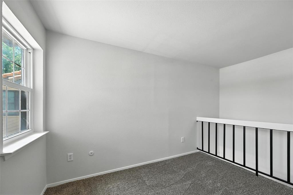5626 Preston Oaks Road, Unit 22C Dallas, TX 75254 - Photo 22 of 29 an empty room with windows