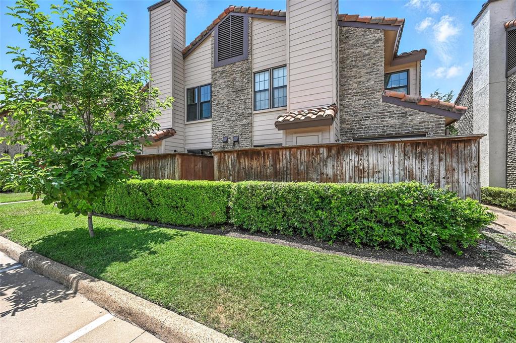 5626 Preston Oaks Road, Unit 22C Dallas, TX 75254 - Photo 3 of 29 a view of a brick house with a yard and plants