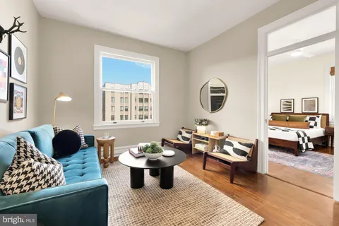 a living room with furniture and a table