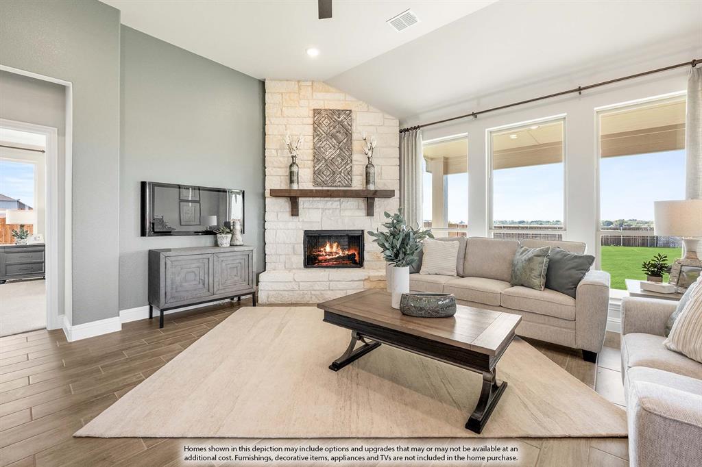 5418 Rutherford Drive Midlothian, TX 76065 - Photo 17 of 40 a living room with furniture a large window and a fireplace