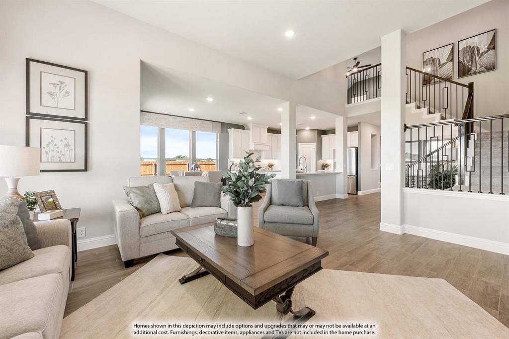 5418 Rutherford Drive Midlothian, TX 76065 - Photo 21 of 40 a living room with furniture potted plant and kitchen view