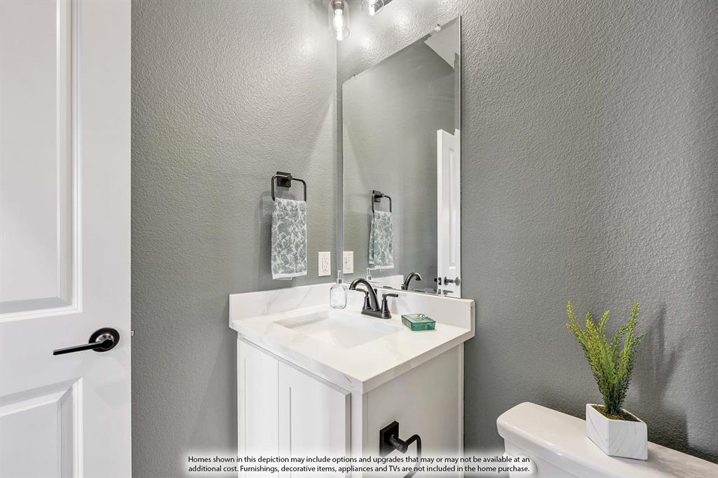 5418 Rutherford Drive Midlothian, TX 76065 - Photo 8 of 40 a bathroom with a sink and a mirror