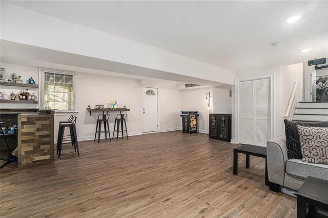 a view of a livingroom with furniture and wooden floor