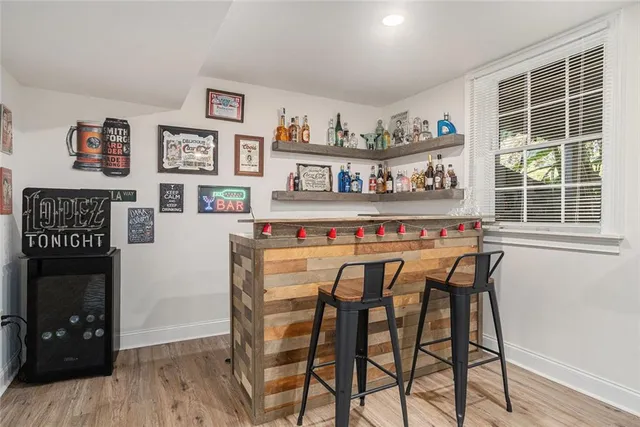 a dining table with chairs and wooden floor