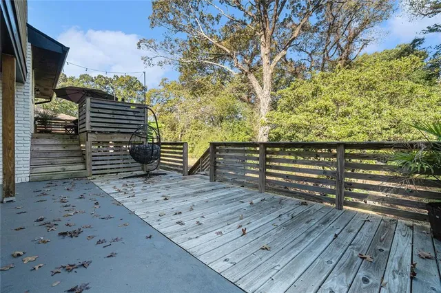 a view of outdoor space with deck and yard