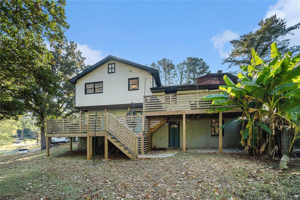 2294 Collier Drive Decatur, GA 30032 - Photo 20 of 31 a front view of a house with a garden