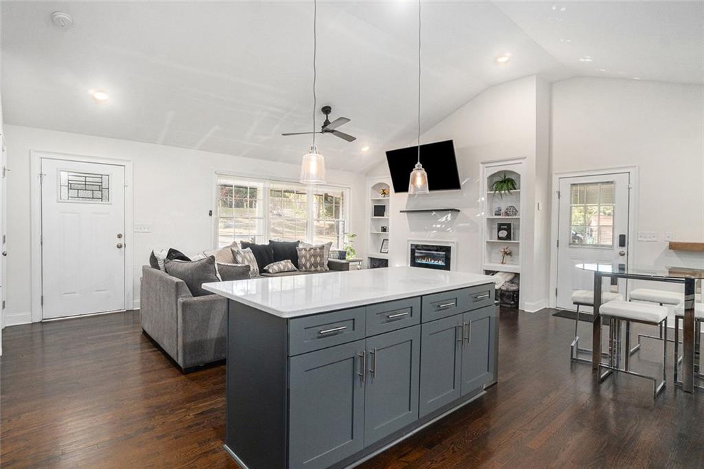 2294 Collier Drive Decatur, GA 30032 - Photo 25 of 31 a view of living room with kitchen island furniture and flat screen tv