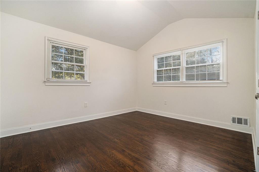 2294 Collier Drive Decatur, GA 30032 - Photo 29 of 31 an empty room with wooden floor and windows