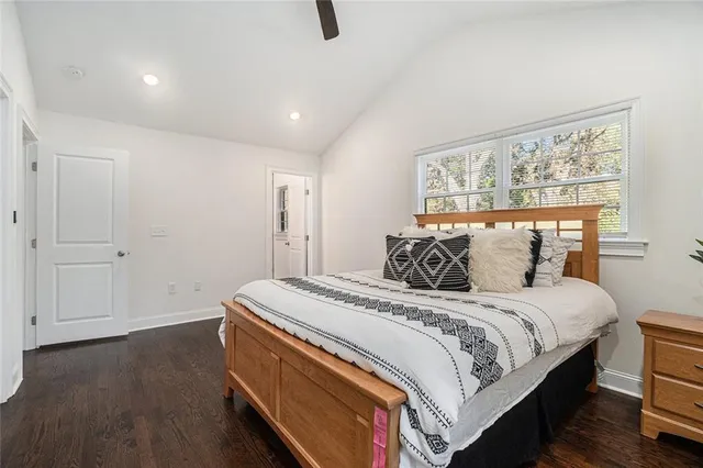 a bed room with a bed and a window