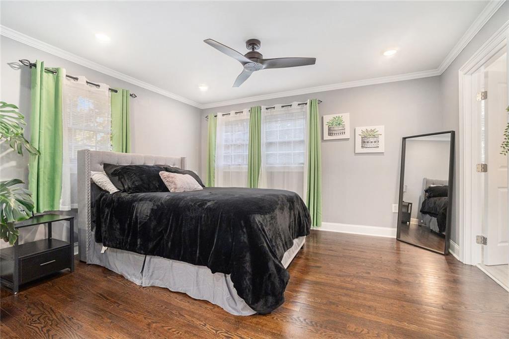 2294 Collier Drive Decatur, GA 30032 - Photo 8 of 31 a spacious bedroom with a bed and a large window