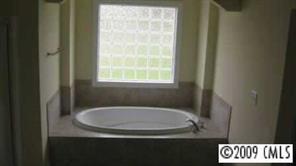 3323 Neal Boyce Road Monroe, NC 28110 - Photo 7 of 8 a bathroom with a sink and a window