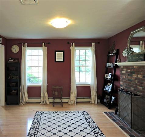 9 Azel Road Freetown, MA 02717 - Photo 4 of 25 a living room with furniture and a fireplace