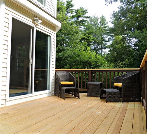 9 Azel Road Freetown, MA 02717 - Photo 8 of 25 a view of a balcony with wooden floor and fence