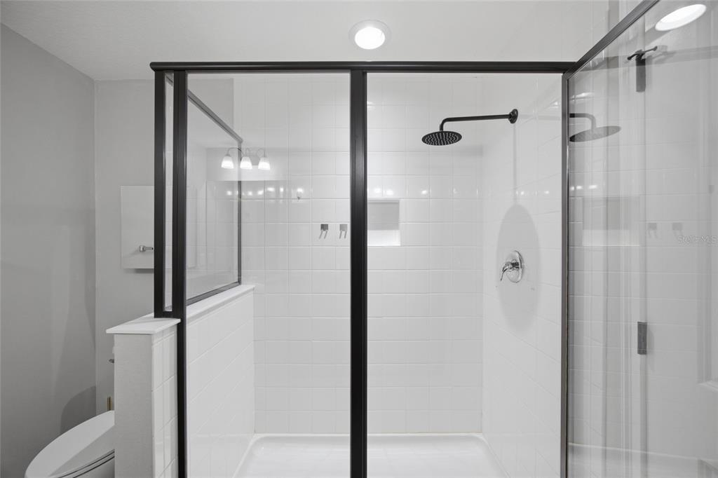 2013 Sunset Wind Loop Oldsmar, FL 34677 - Photo 20 of 43 a bathroom with a glass shower door