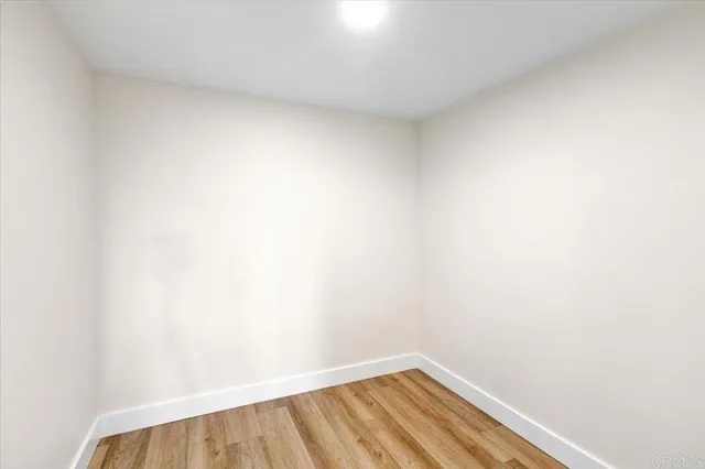 a bedroom with a bed and table chair