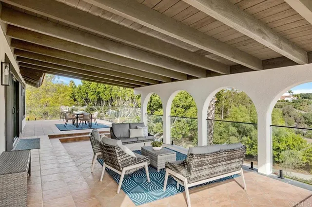 a view of a patio with a table and chairs
