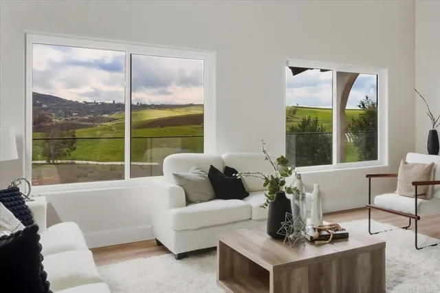a living room with furniture and a large window