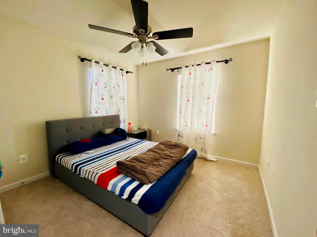 7014 Foxton Way Hanover, MD 21076 - Photo 14 of 29 Cozy bedroom with natural light.