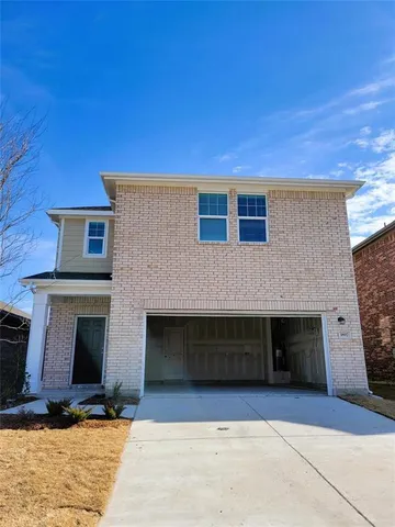 a front view of a house with yard