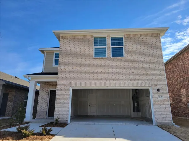 a front view of a house with a garage