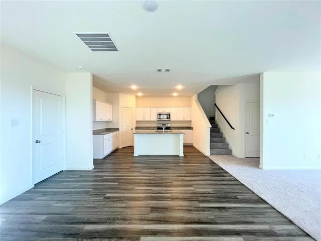 a kitchen with a sink stove and microwave