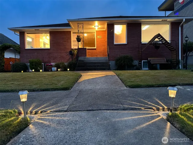 a front view of a house with a yard