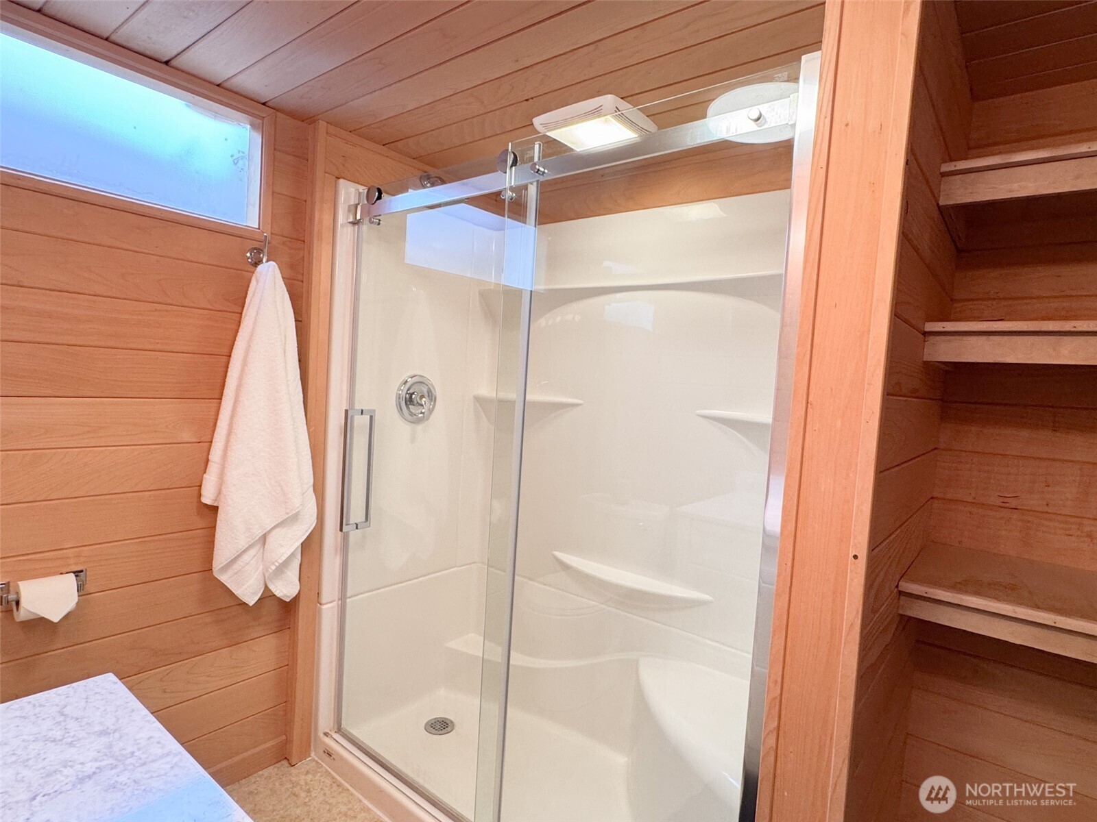 126 West 6th Street Port Angeles, WA 98362 - Photo 23 of 40 a bathroom with a shower and a glass door