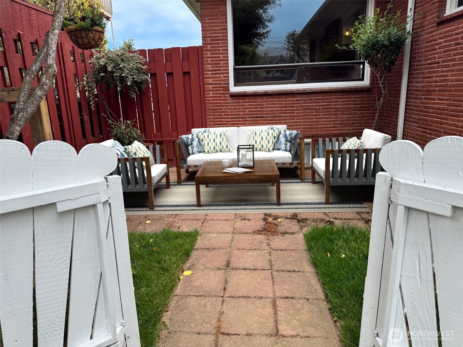 126 West 6th Street Port Angeles, WA 98362 - Photo 32 of 40 a view of a patio with couches and table and chairs with wooden floor