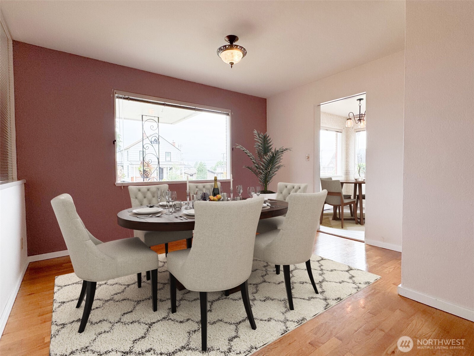 126 West 6th Street Port Angeles, WA 98362 - Photo 5 of 40 a dining room with furniture a rug and wooden floor