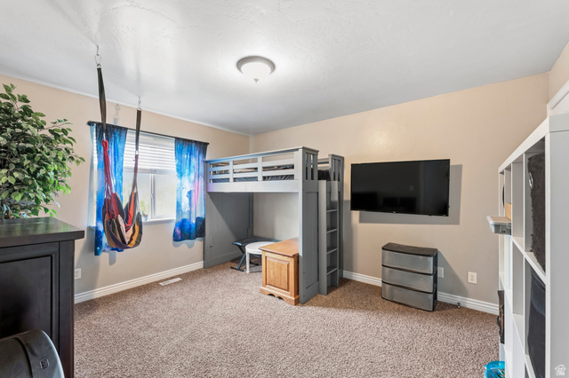 1165 West 100 South Springville, UT 84663 - Photo 13 of 28 Unfurnished bedroom featuring baseboards and light colored carpet