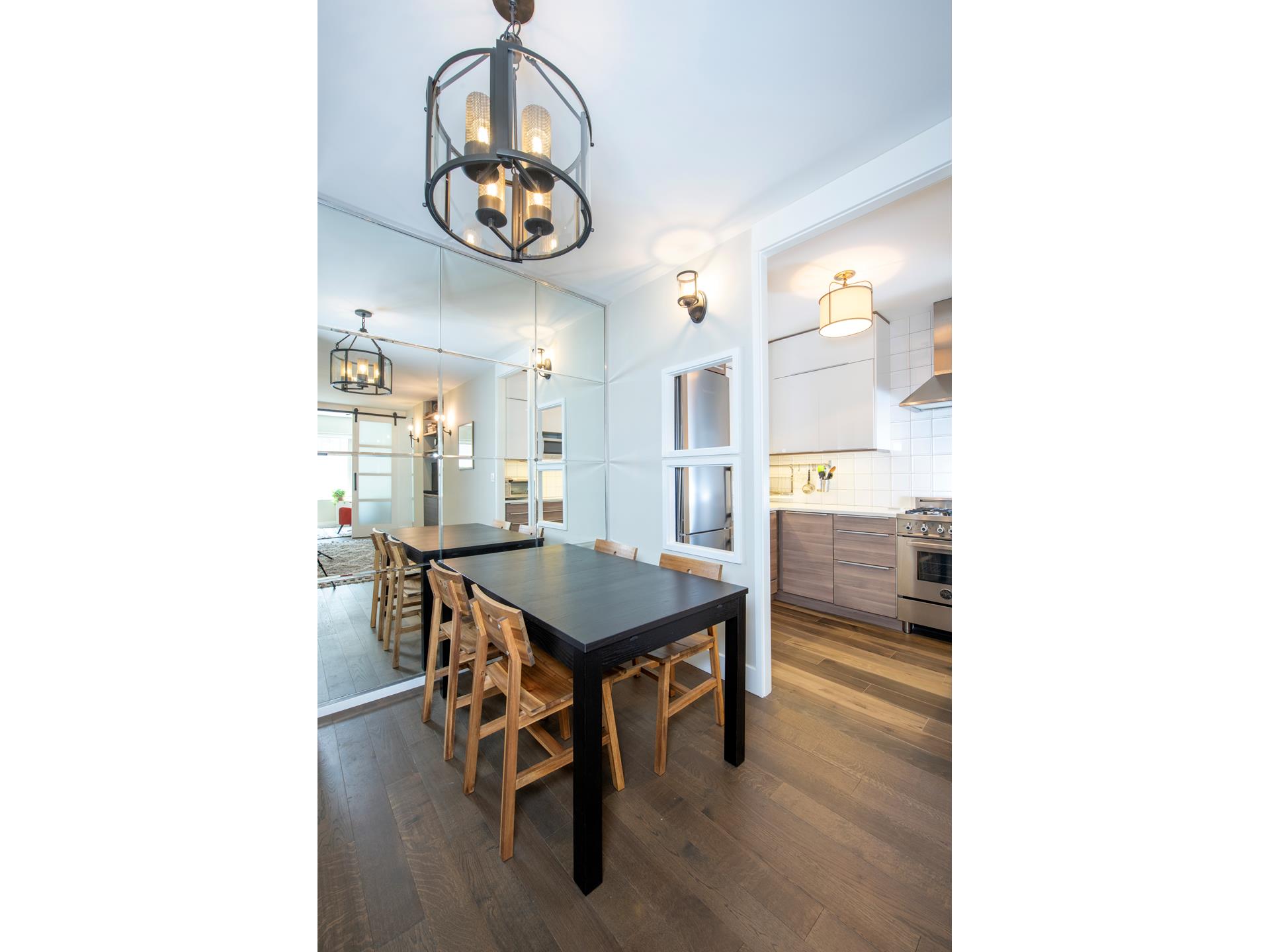 370 East 76th Street, Unit C1003 Manhattan, NY 10021 - Photo 6 of 9 a view of a dining room with a table and chairs