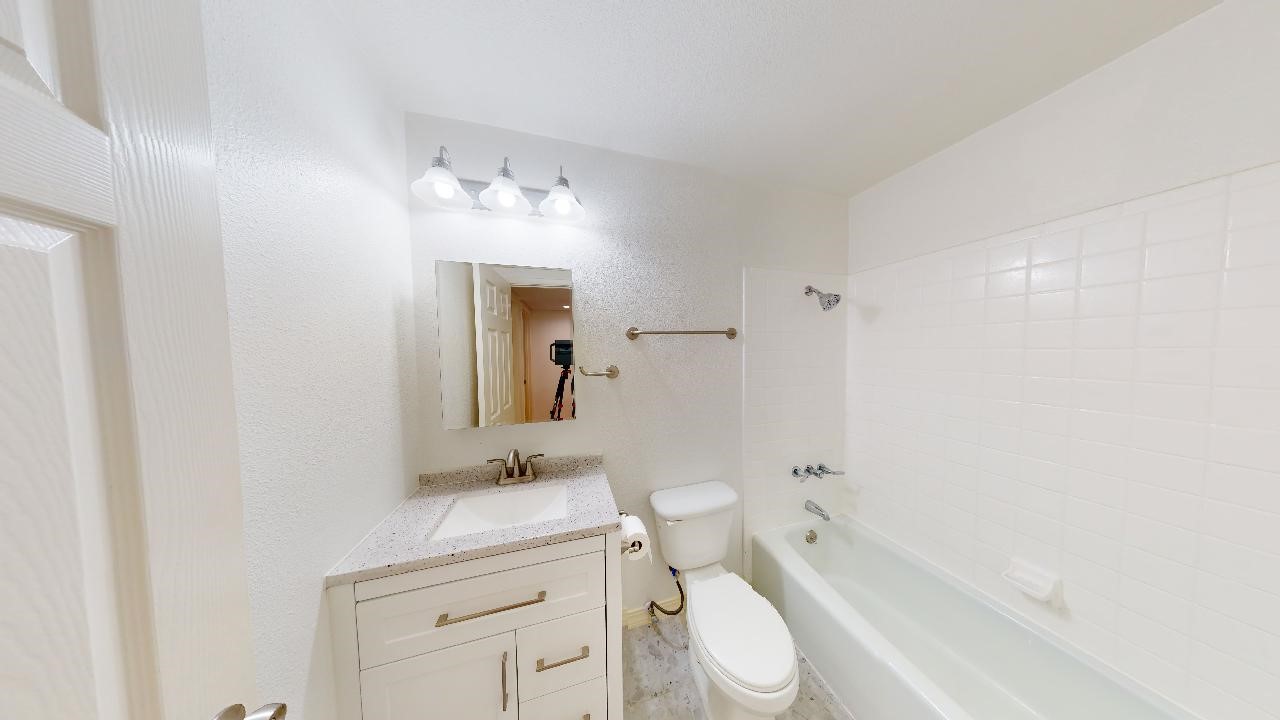 500 East Riverside Drive, Unit 132 Austin, TX 78704 - Photo 17 of 18 a bathroom with a sink a toilet and shower