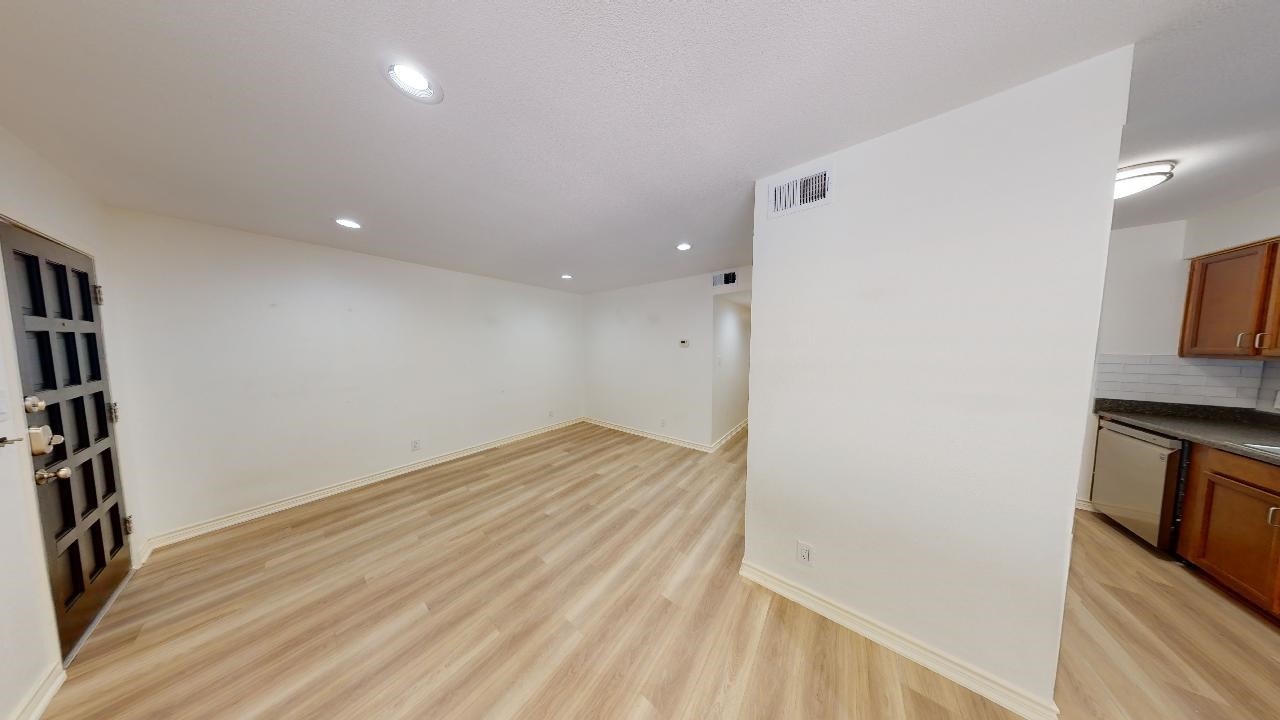 500 East Riverside Drive, Unit 132 Austin, TX 78704 - Photo 3 of 18 a view of a kitchen from the hallway