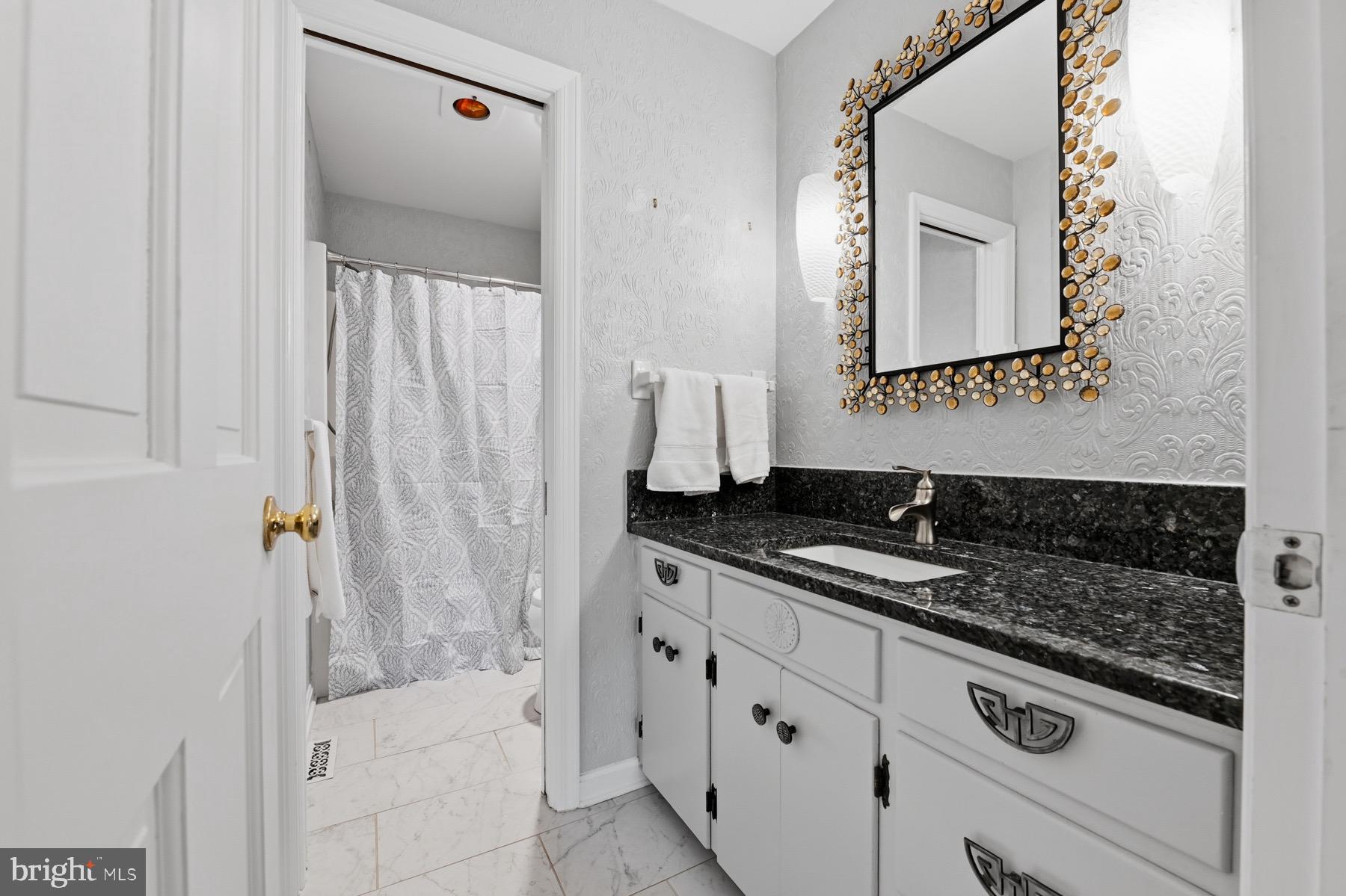 2907 Lawndale Road Finksburg, MD 21048 - Photo 44 of 75 a bathroom with a granite countertop sink and a mirror