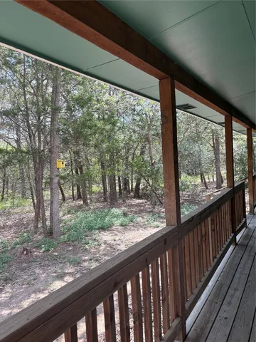 a view of a yard from a balcony