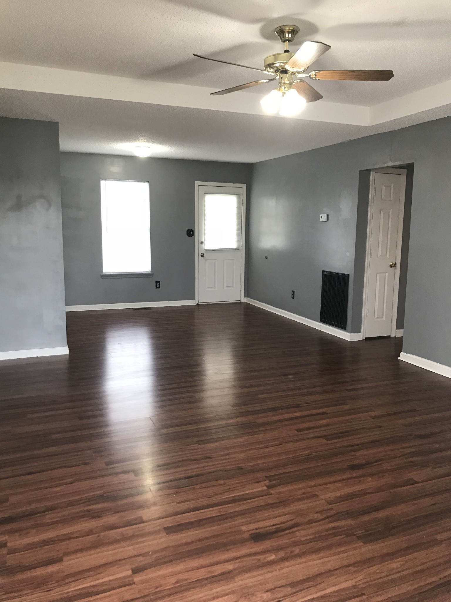 200 Rusty Drive Oak Grove, KY 42262 - Photo 3 of 8 a view of an empty room with window and wooden floor