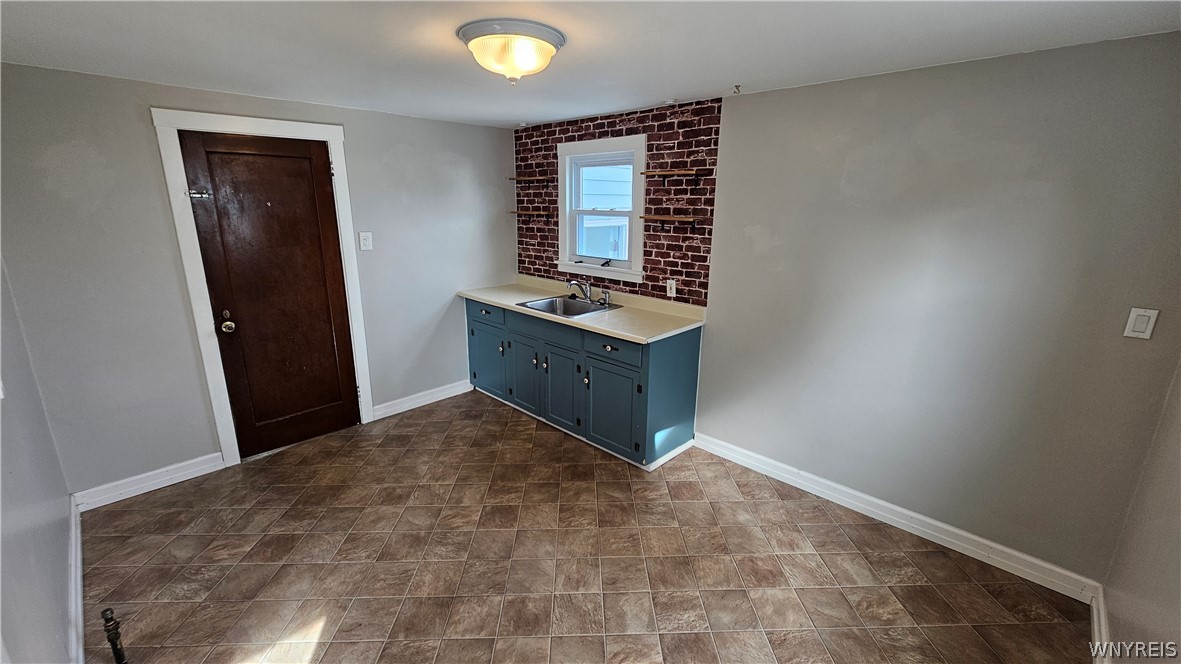 107 Fowler Avenue, Unit RIGHT Tonawanda, NY 14217 - Photo 7 of 24 Kitchen looking to rear hallway door (gas range and refridgerator will be installed along the left side wall).