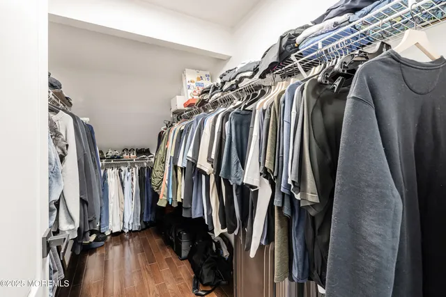 a bedroom with a bed and a flat screen television