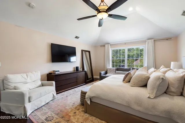 a white bath tub sitting next to a shower