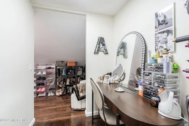 a bedroom with two beds and a large window
