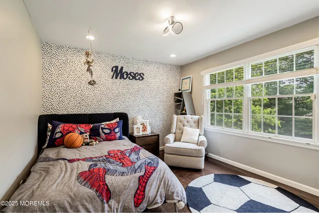 a living room with furniture pool and a flat screen tv